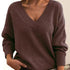 Women’s solid V-neck loose long sleeve knitted pullover sweater.