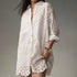 Women’s white solid color hollow buckle lapel shirt, loose fit daily top.