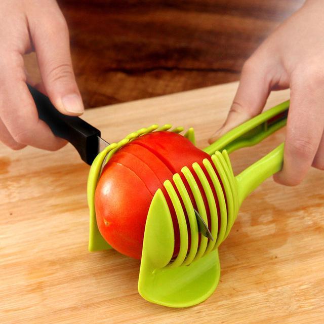 Plastic fruit and vegetable cutting holder with slicing guide slots