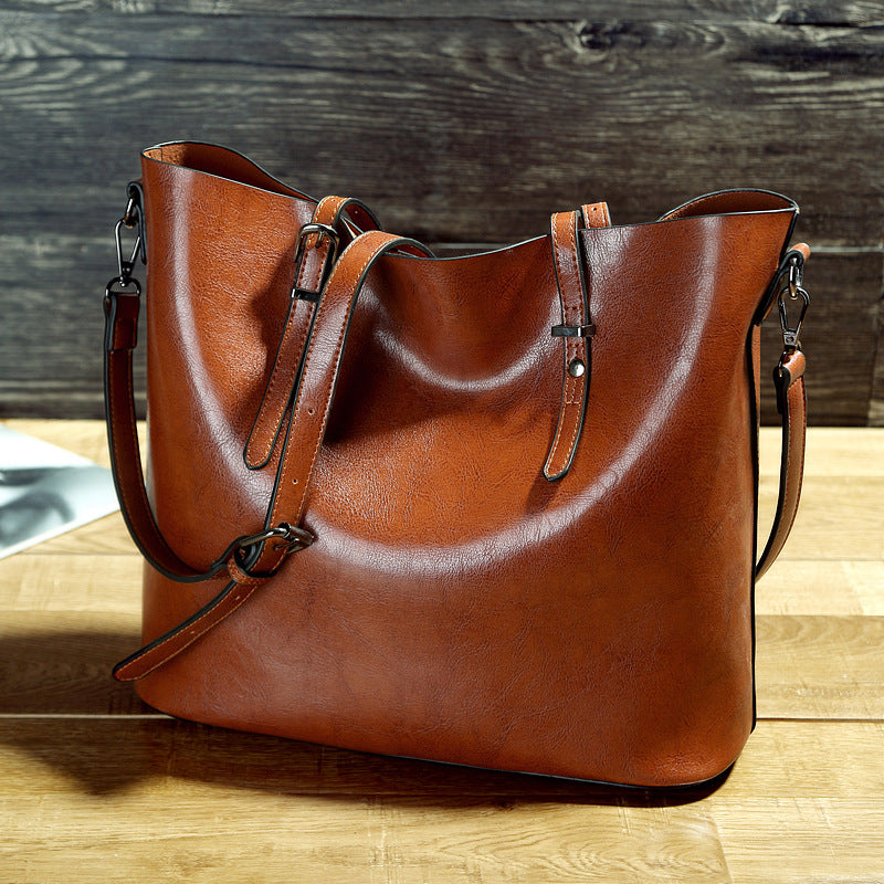 Women’s oil wax leather high-capacity shoulder messenger tote bag.