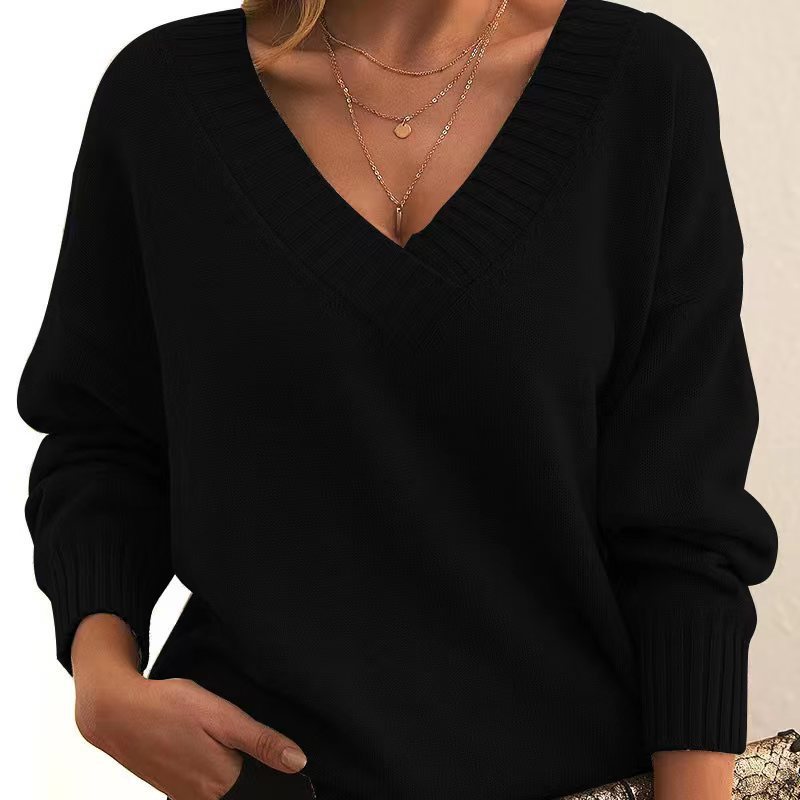 Women’s solid V-neck loose long sleeve knitted pullover sweater.