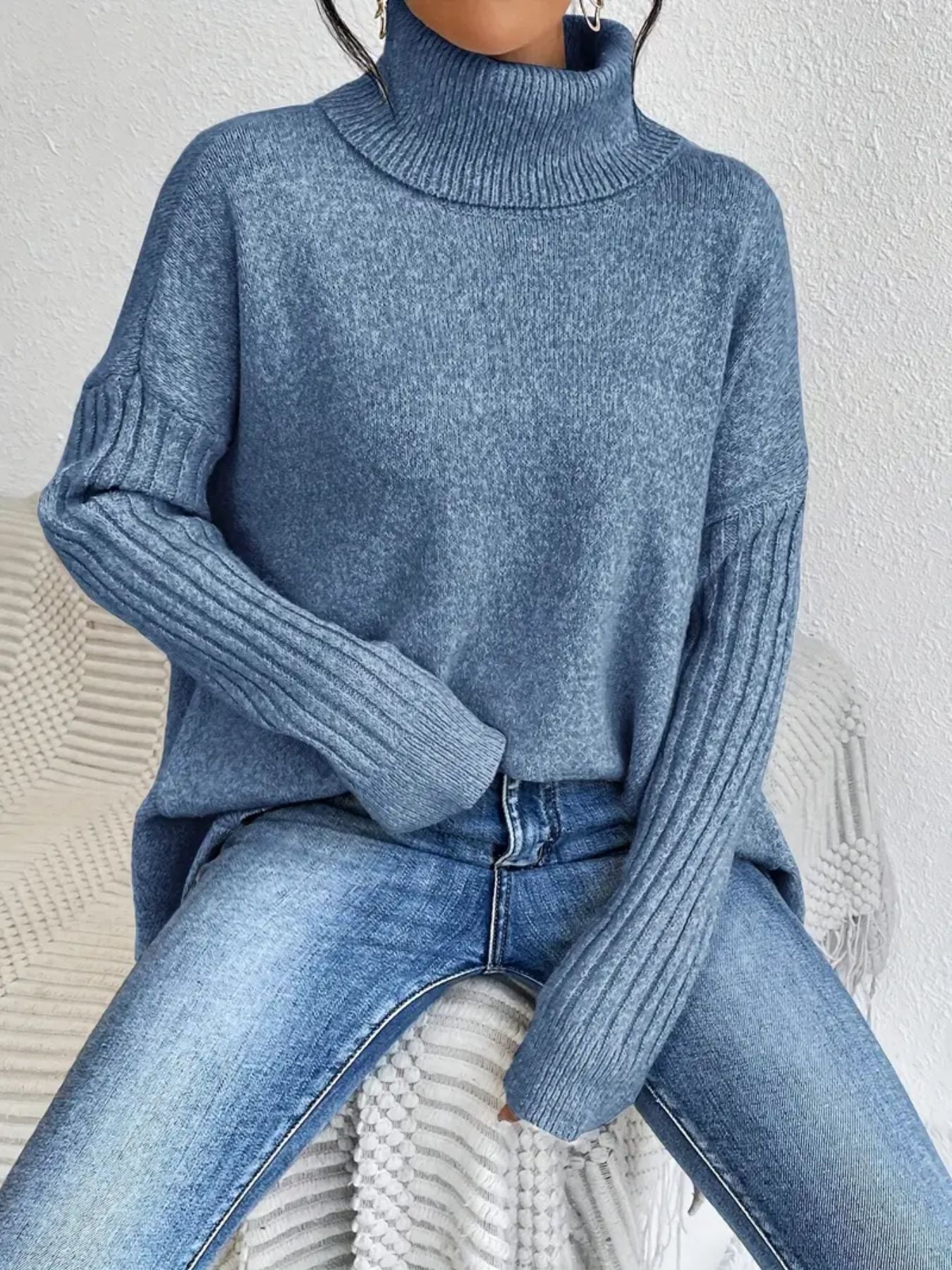 Women’s irregular turtleneck long sleeve loose knit sweater.