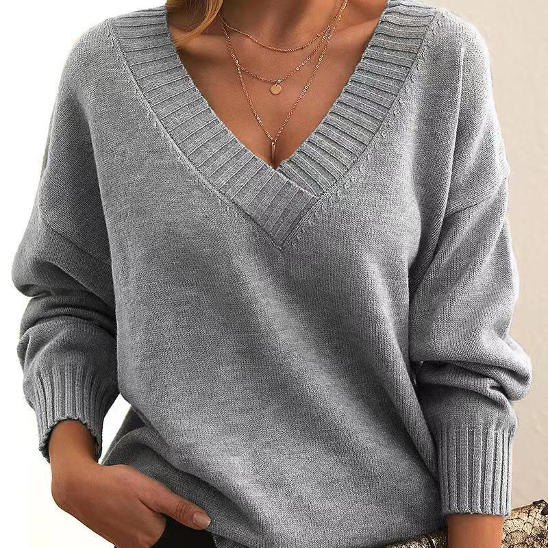 Women’s solid V-neck loose long sleeve knitted pullover sweater.