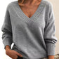 Women’s solid V-neck loose long sleeve knitted pullover sweater.