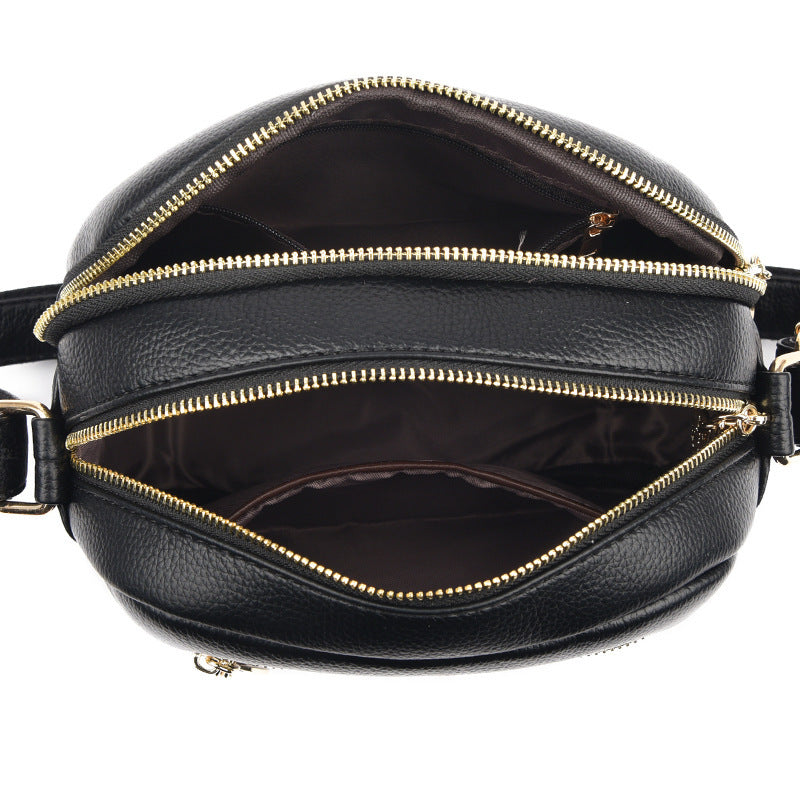 Women’s small round crossbody bag made of genuine leather, lightweight and stylish.