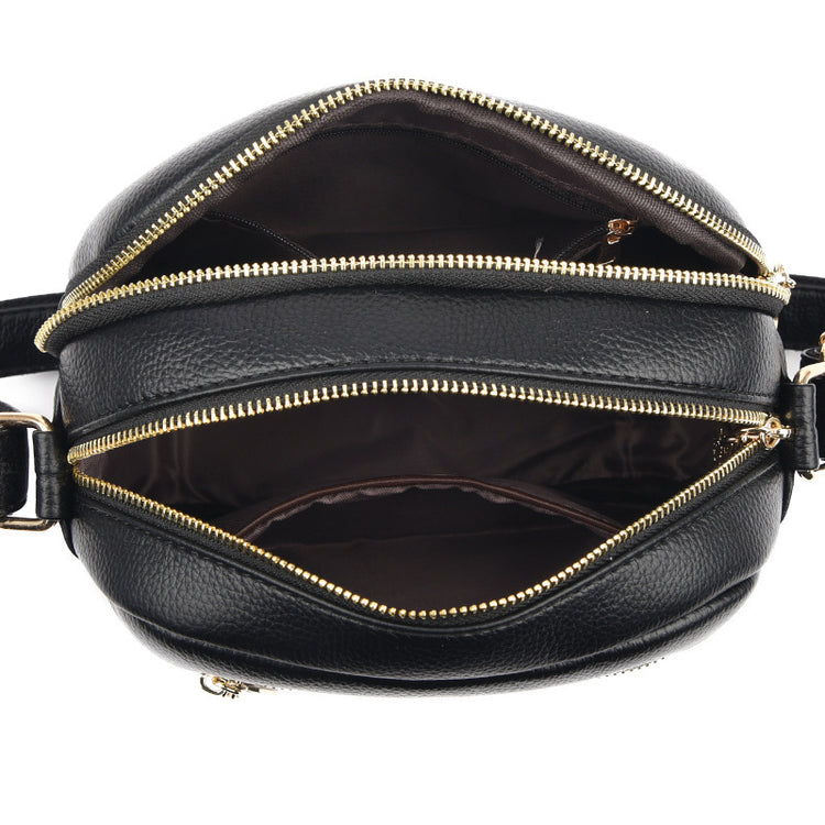 Women’s small round crossbody bag made of genuine leather, lightweight and stylish.