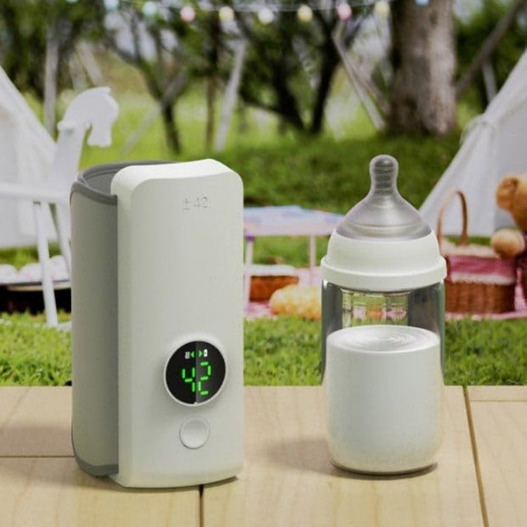 Portable USB baby bottle warmer with wrap-around heating design.