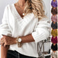Women’s solid V-neck loose long sleeve knitted pullover sweater.