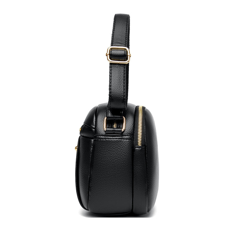 Women’s small round crossbody bag made of genuine leather, lightweight and stylish.