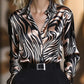Women’s abstract print V-neck button-down blouse, long sleeve casual top.