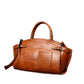 Women’s genuine leather dumpling-style crossbody zip bag.
