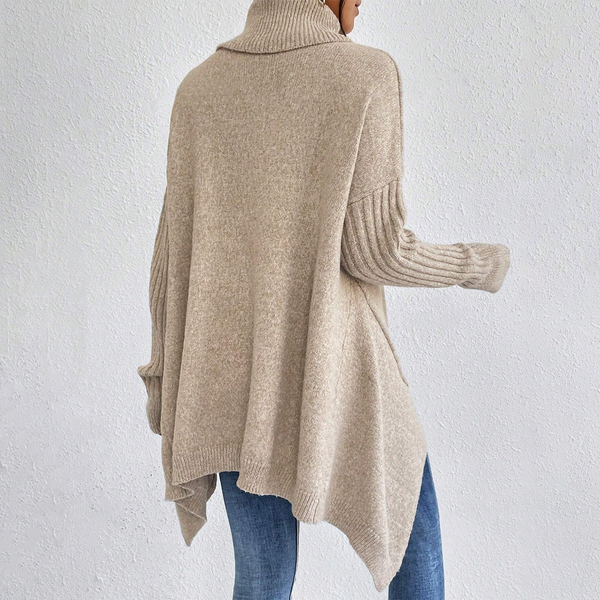 Women’s irregular turtleneck long sleeve loose knit sweater.
