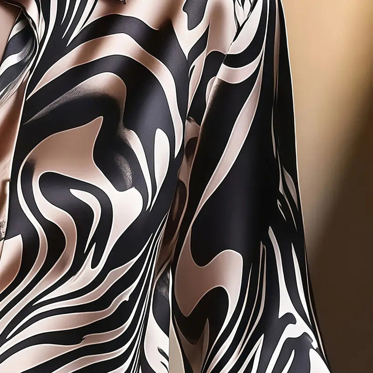 Women’s abstract print V-neck button-down blouse, long sleeve casual top.